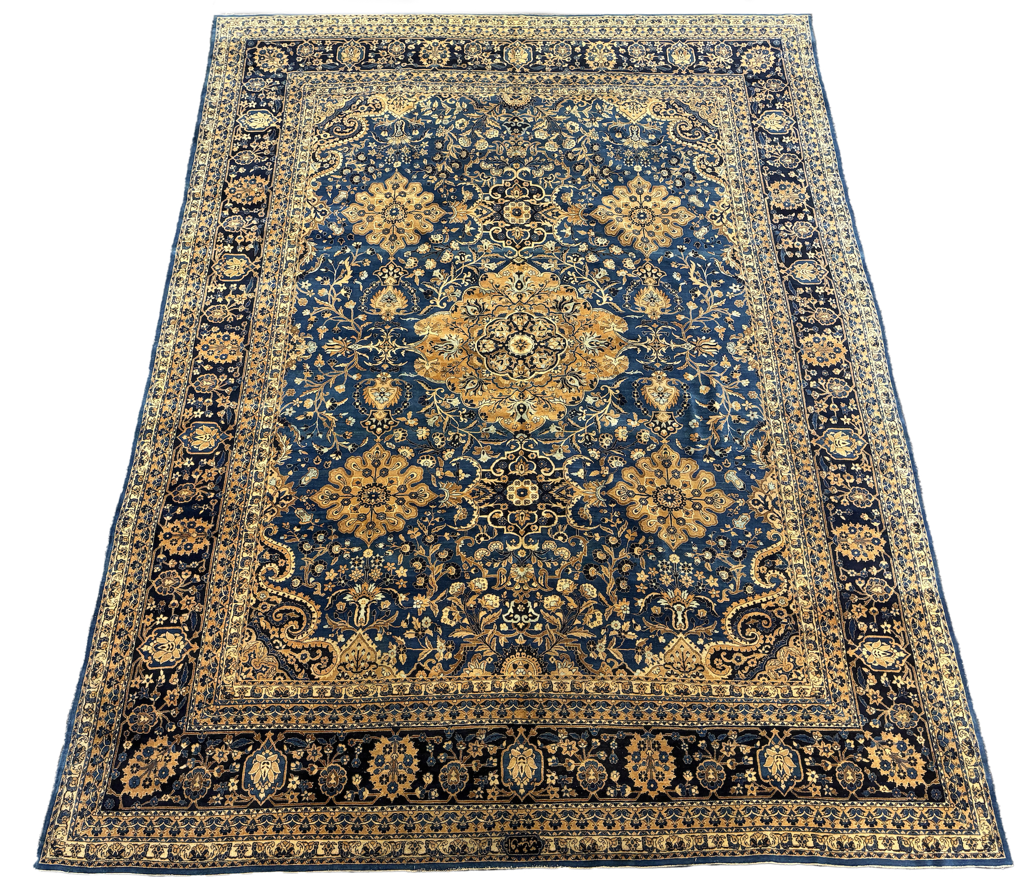 An early 20th century Kirman blue ground carpet, 425 x 325cm